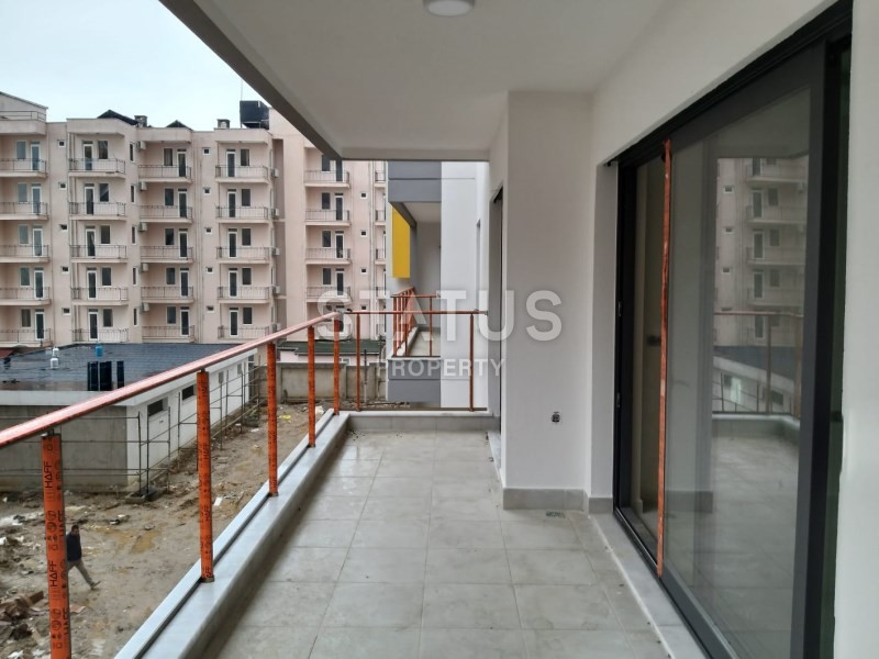 Комплекс на первой береговой линии в районе Махмутлар 90 кв.м. фото 13