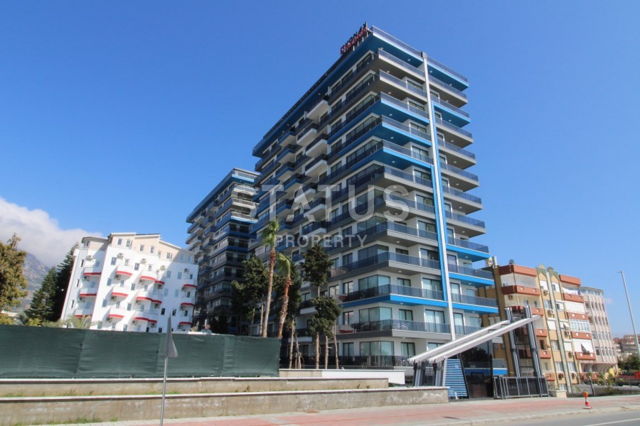 Апартаменты 2+1 на первой береговой линии с видом на горы и море в Махмутларе! 95 кв. м. фото 1