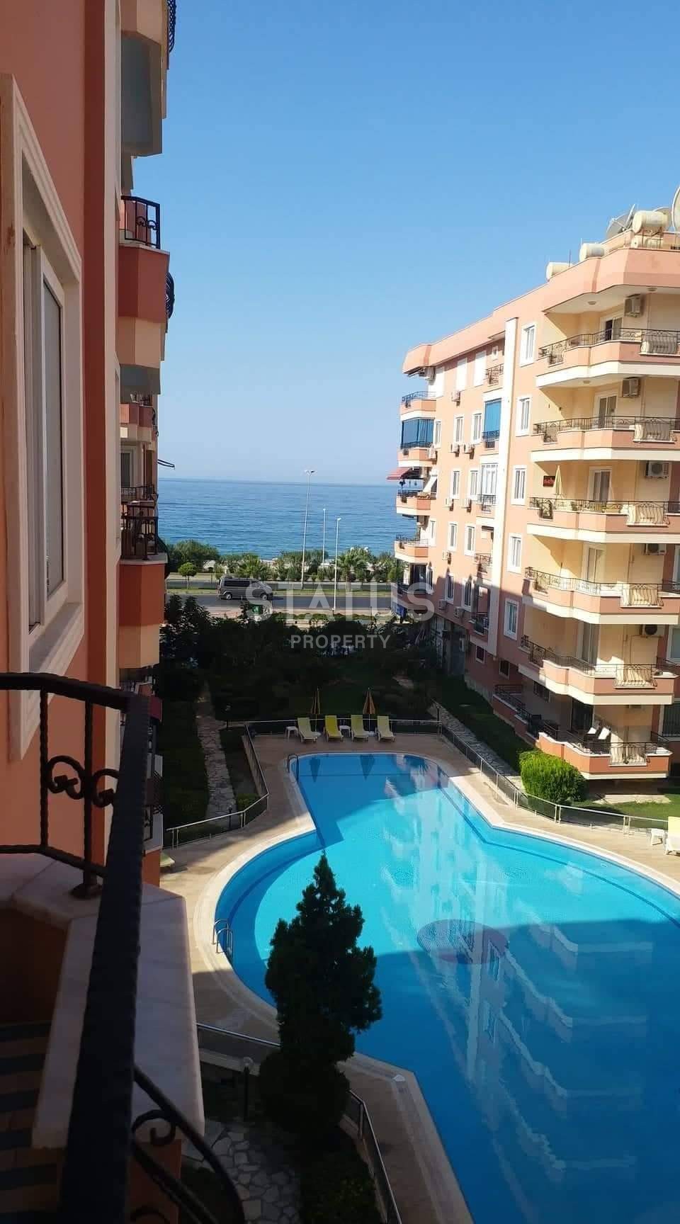 Квартира 2+1 в Махмутларе на первой линии с боковым видом на море фото 3