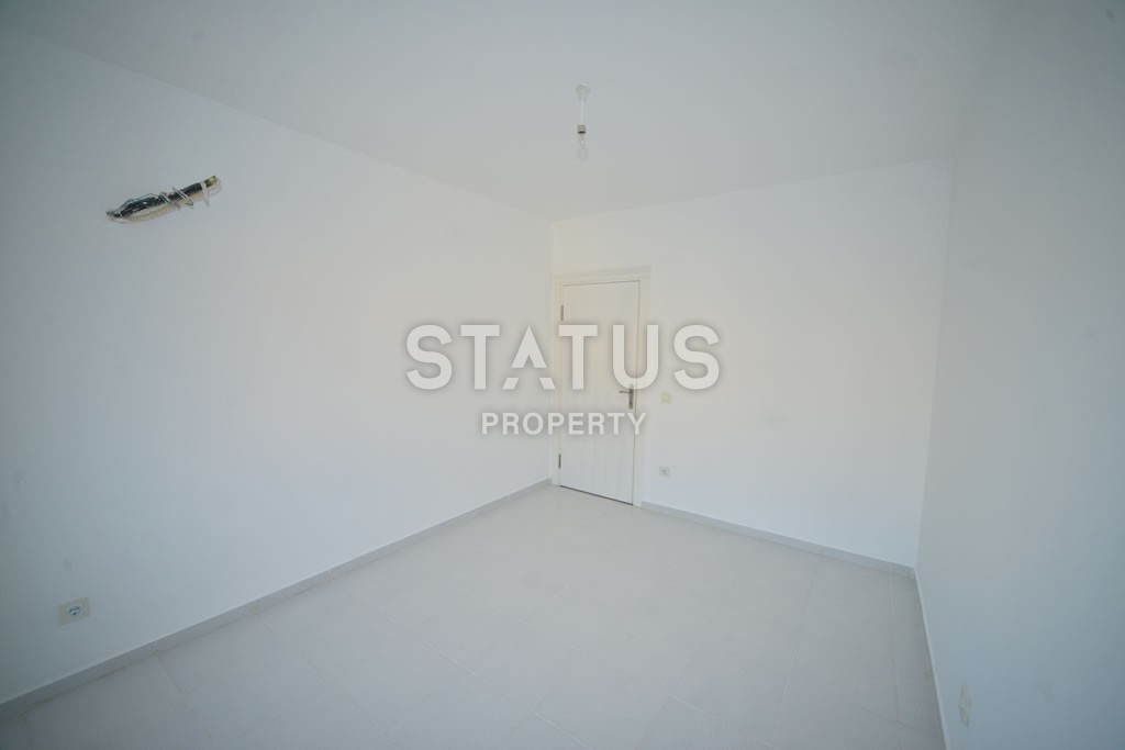 Квартира в Махмутларе недорого в доме с бассейном 60 кв.м. фото 3