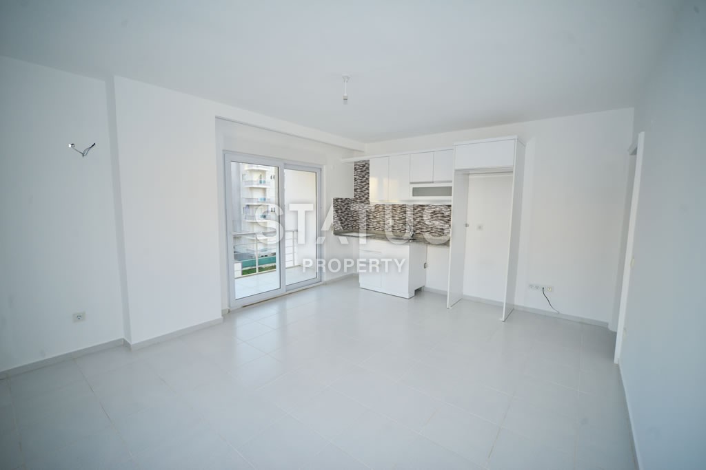 Квартира в Махмутларе недорого в доме с бассейном 60 кв.м. фото 5