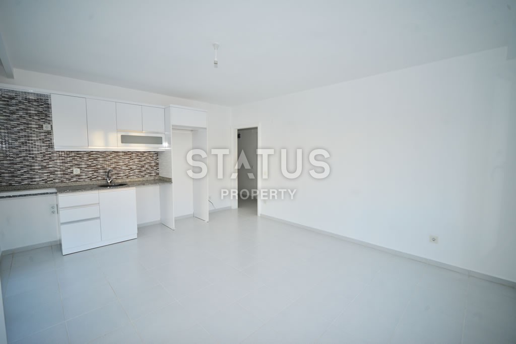 Квартира в Махмутларе недорого в доме с бассейном 60 кв.м. фото 6