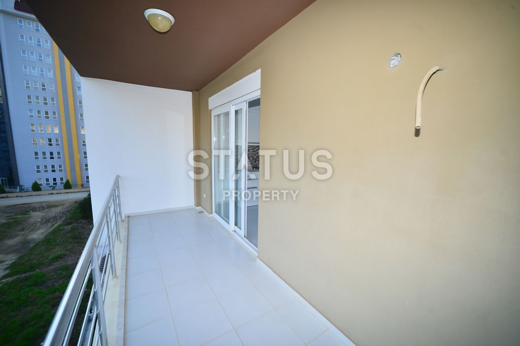 Квартира в Махмутларе недорого в доме с бассейном 60 кв.м. фото 7