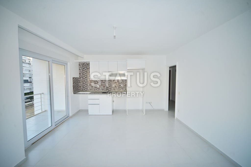 Квартира в Махмутларе недорого в доме с бассейном 60 кв.м. фото 8