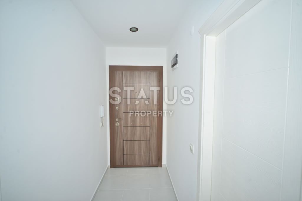 Квартира в Махмутларе недорого в доме с бассейном 60 кв.м. фото 9