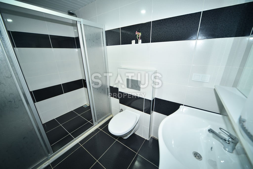 Квартира в Махмутларе недорого в доме с бассейном 60 кв.м. фото 10