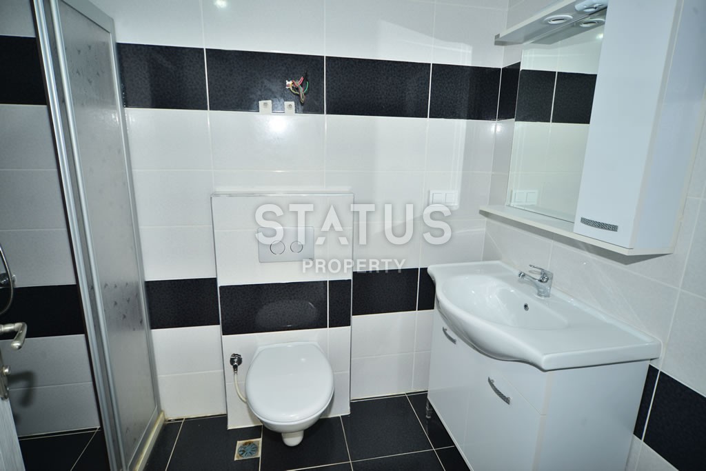 Квартира в Махмутларе недорого в доме с бассейном 60 кв.м. фото 14