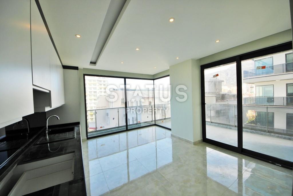 Светлая трехкомнатные апартаменты на первой береговой линии в районе Махмутлар фото 7