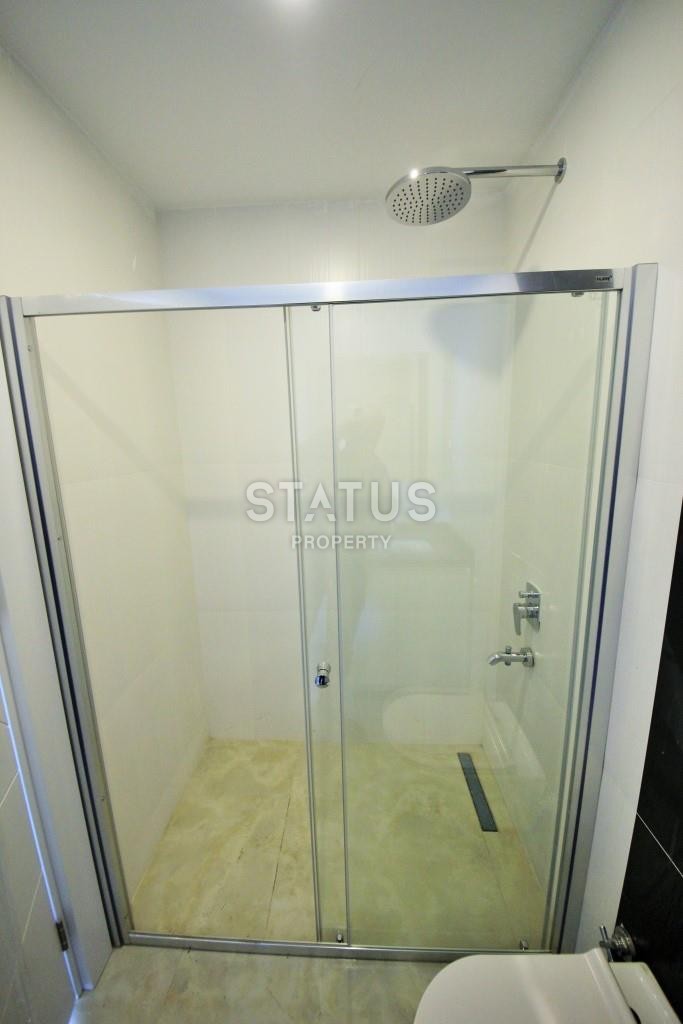 Светлая трехкомнатные апартаменты на первой береговой линии в районе Махмутлар фото 10