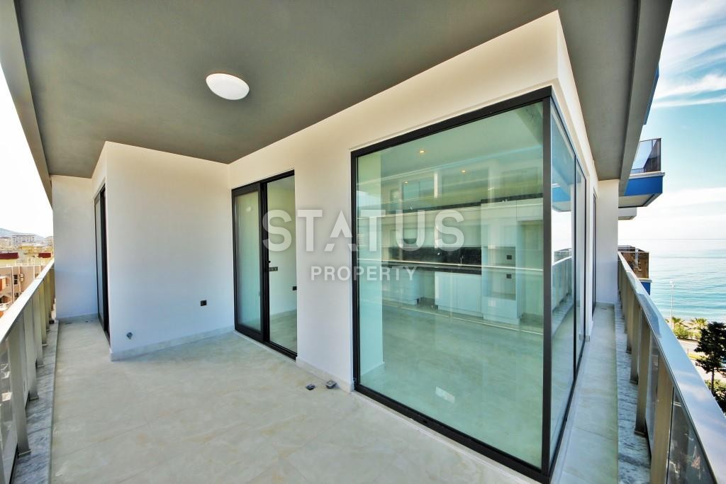 Светлая трехкомнатные апартаменты на первой береговой линии в районе Махмутлар фото 11