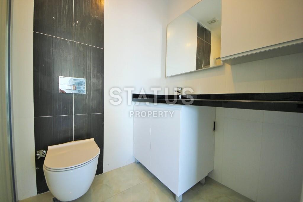 Светлая трехкомнатные апартаменты на первой береговой линии в районе Махмутлар фото 12