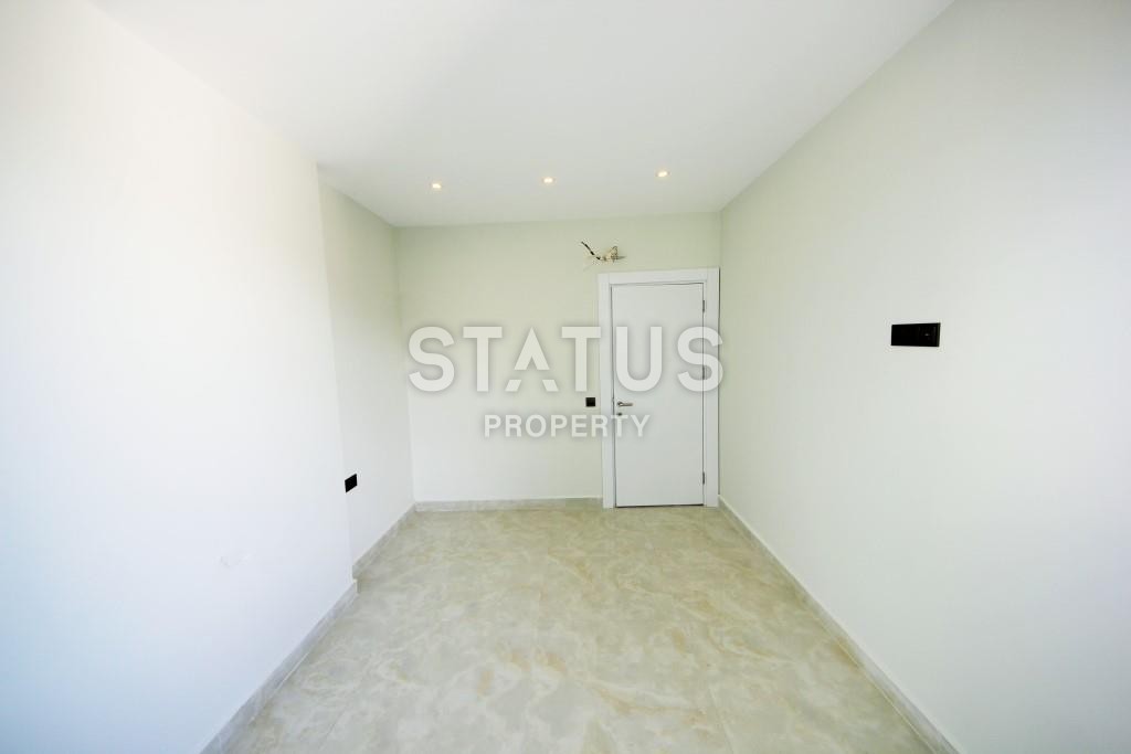 Светлая трехкомнатные апартаменты на первой береговой линии в районе Махмутлар фото 13