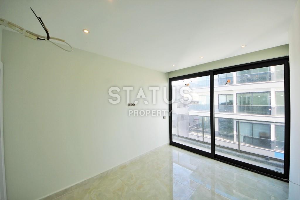 Светлая трехкомнатные апартаменты на первой береговой линии в районе Махмутлар фото 14