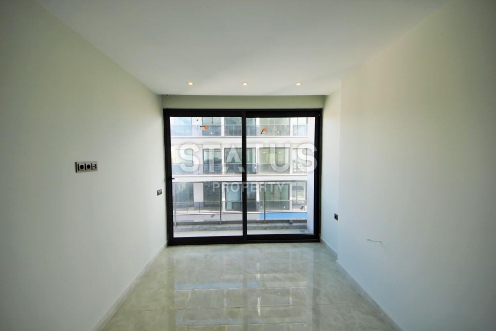 Светлая трехкомнатные апартаменты на первой береговой линии в районе Махмутлар фото 15