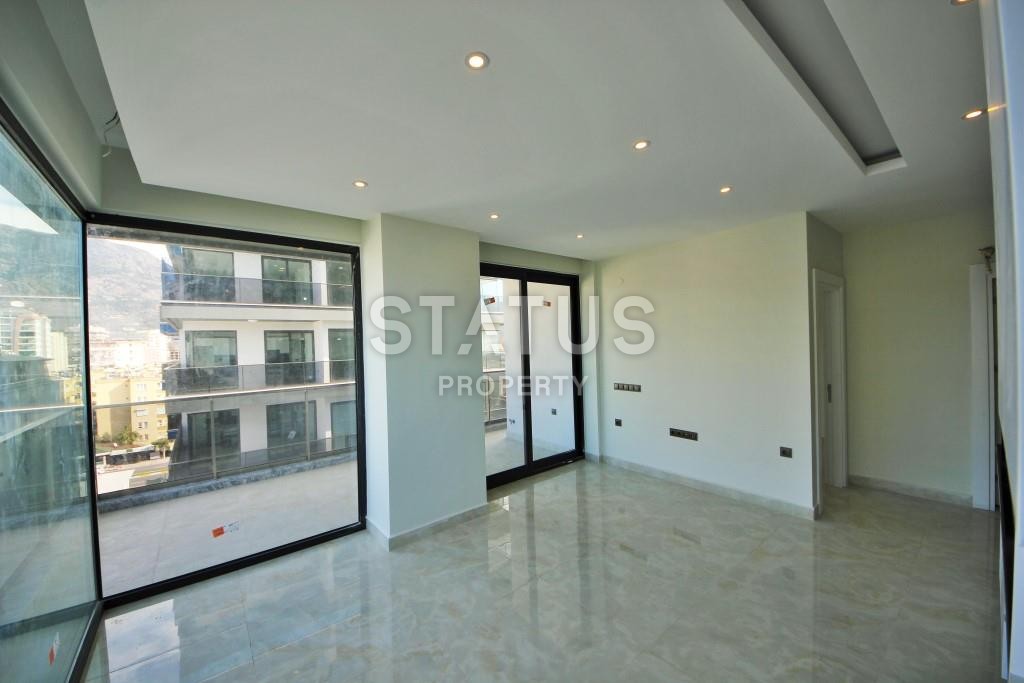 Светлая трехкомнатные апартаменты на первой береговой линии в районе Махмутлар фото 16