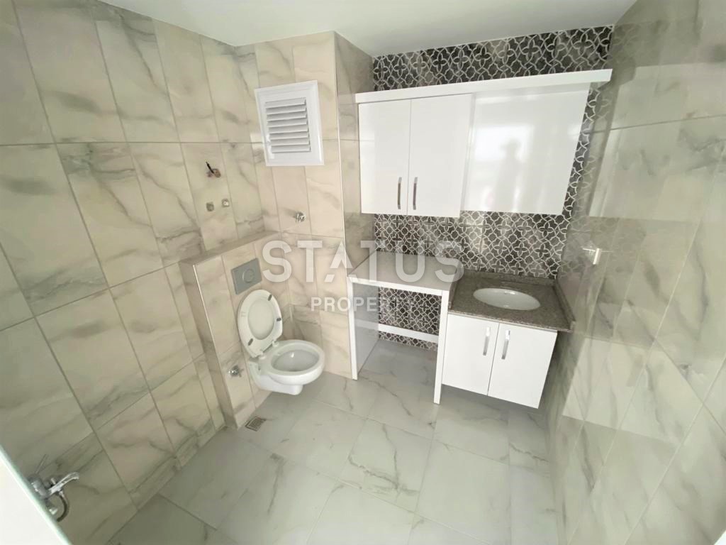 Новая трехкомнатная квартира в Махмутларе, 100 м2 фото 15