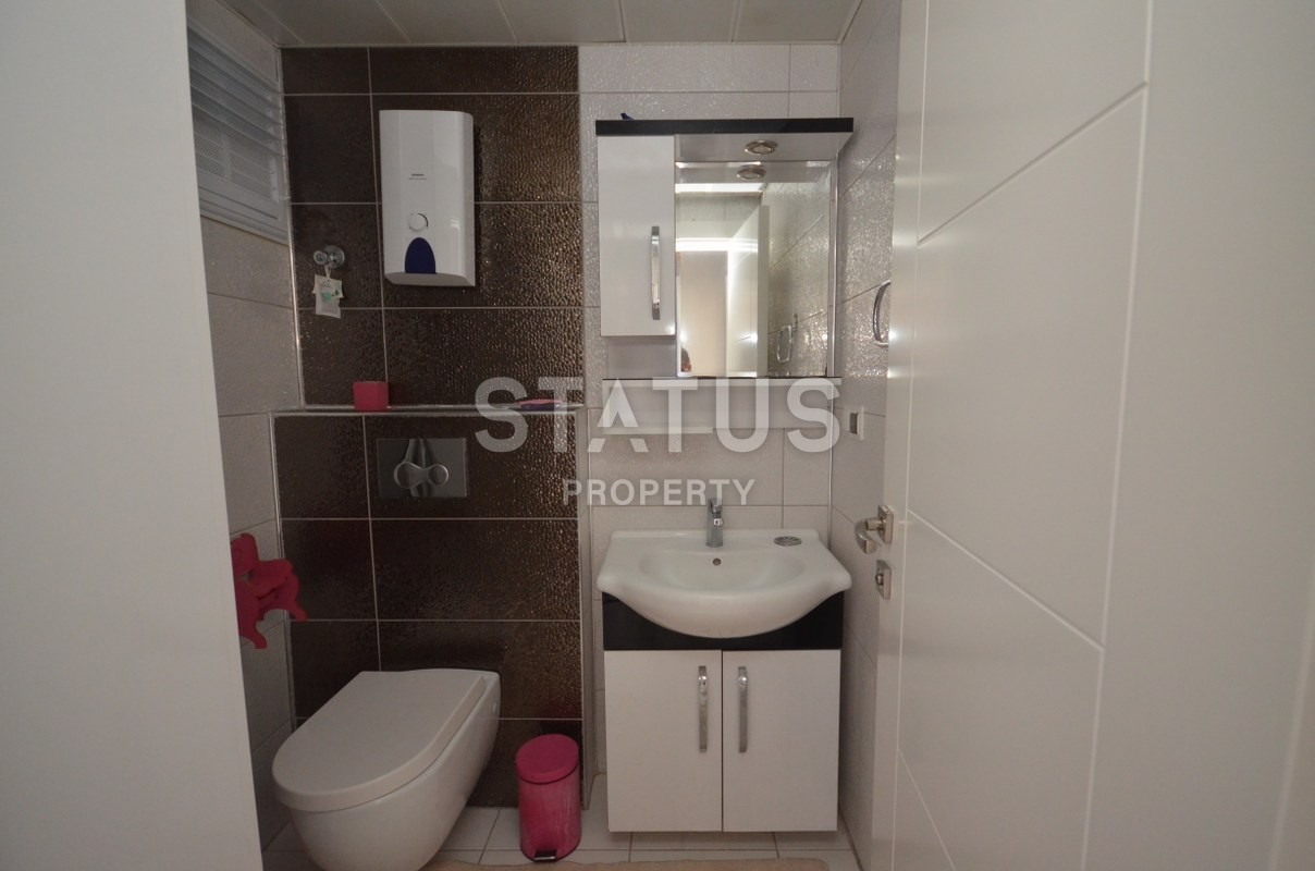 Меблированная двухкомнатная квартира в Махмутларе, 60 м2 фото 22