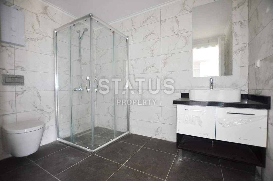 Новая двухкомнатная квартира в Махмутларе, 70 м2 фото 13