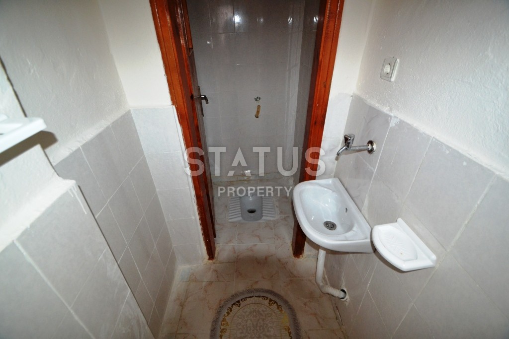 Недорогая трехкомнатная квартира в нескольких минутах от Средиземного моря в районе Махмутлар! фото 9