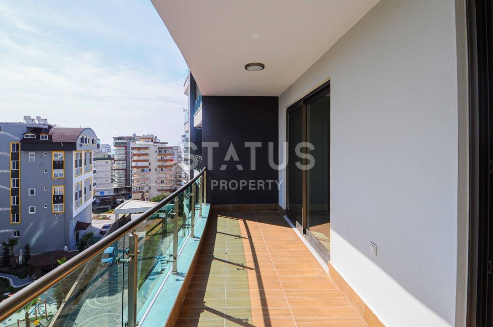 Просторные апартаменты 1+1 в отличном комплексе в Махмутларе фото 3