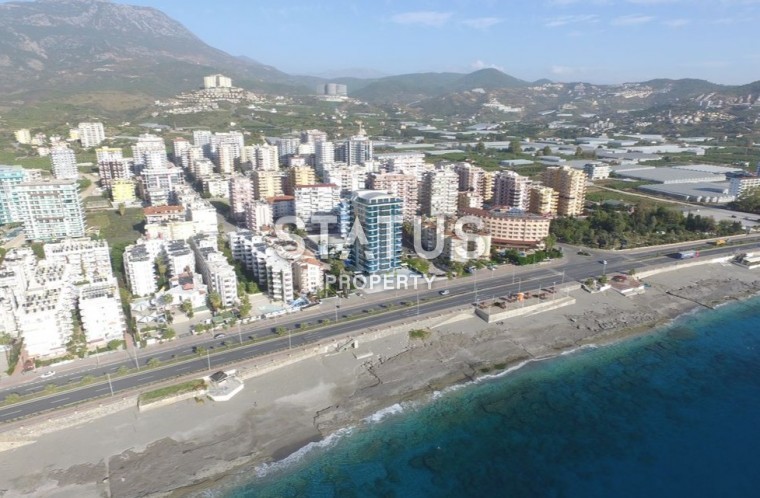 Квартиры 2+1 в новом комплексе на первой береговой линии в Махмутларе фото 1