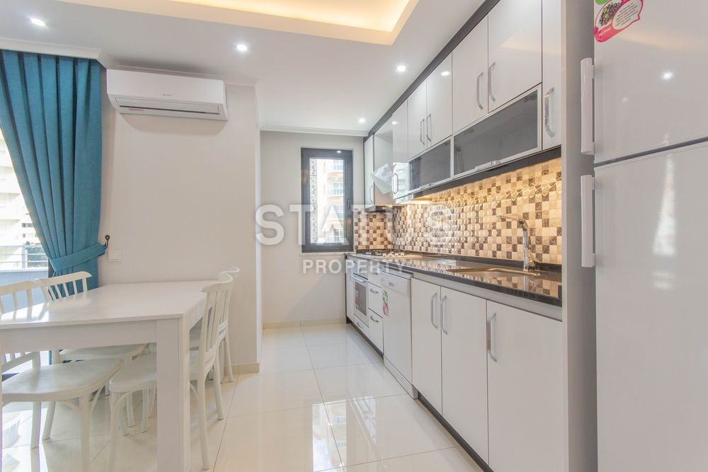 Апартаменты 1+1 в комплексе, рядом с морем в Махмутларе, 75 м2. фото 8