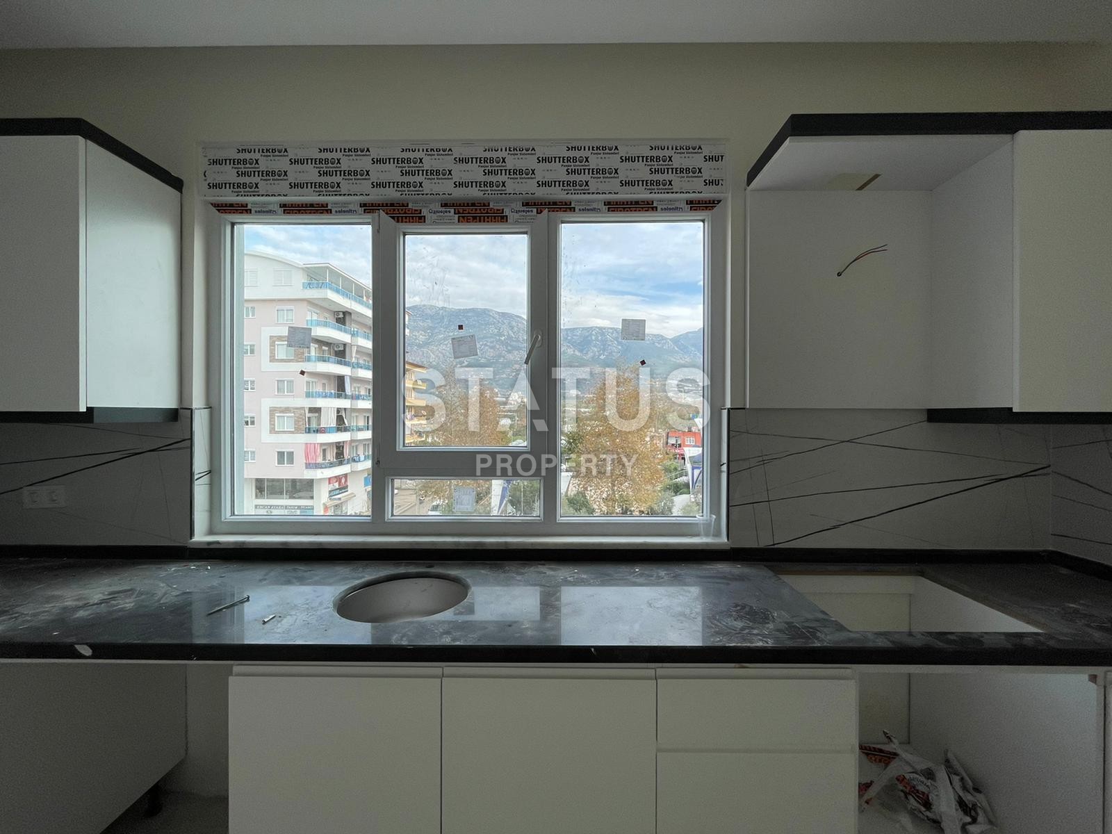 Апартаменты 1+1 в новом комплексе в центре Махмутлара, 45 м2. фото 5