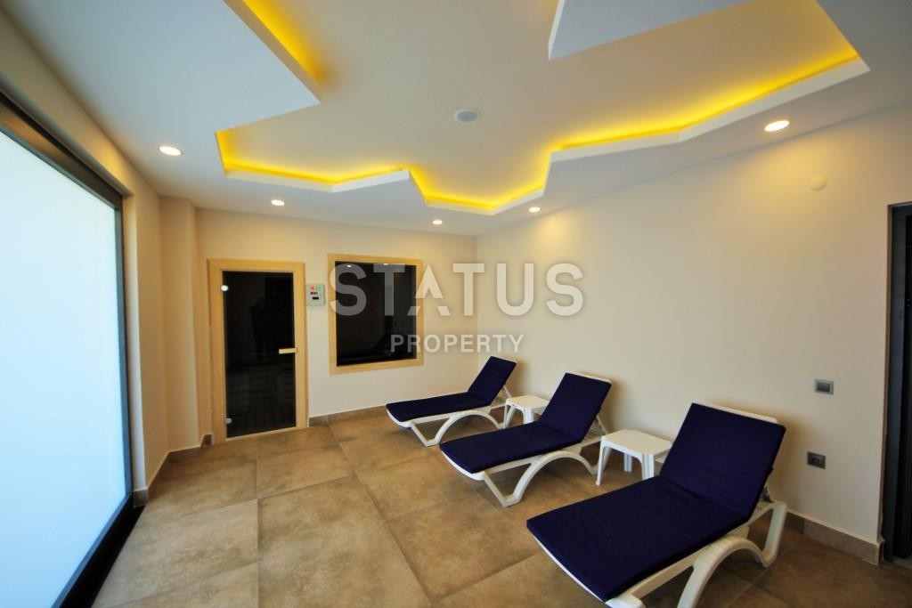 Апартаменты 1+1 в новом элитном комплексе на первой линии в Махмутларе, 55 м2. фото 4