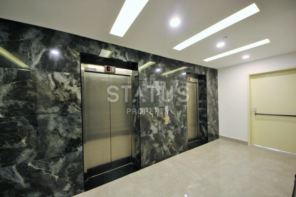 Апартаменты 1+1 в новом элитном комплексе на первой линии в Махмутларе, 55 м2. фото 10