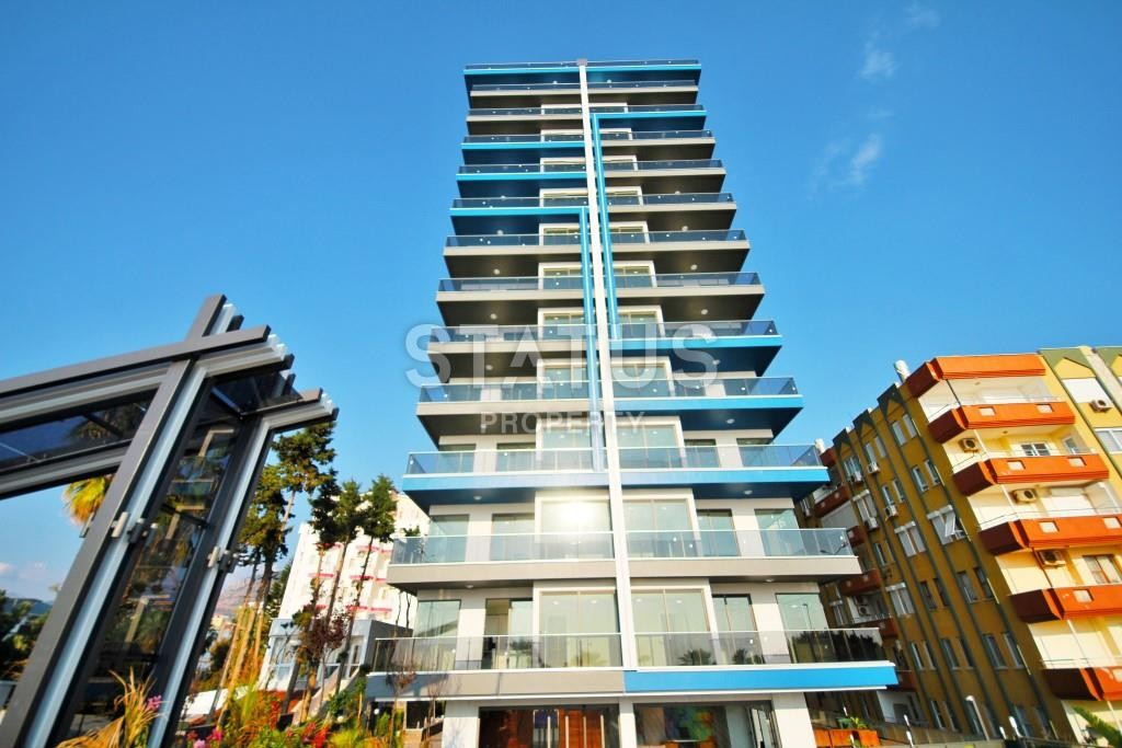 Апартаменты 1+1 в новом элитном комплексе на первой линии в Махмутларе, 55 м2. фото 17