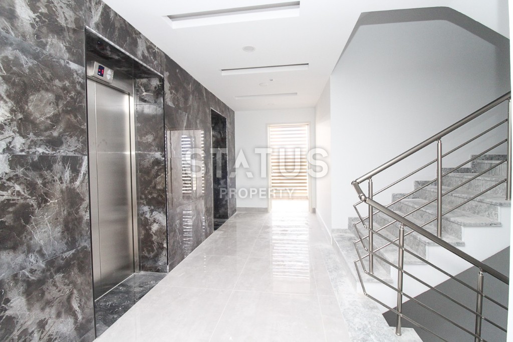 Апартаменты 1+1 в новом элитном комплексе на первой линии в Махмутларе, 55 м2. фото 25