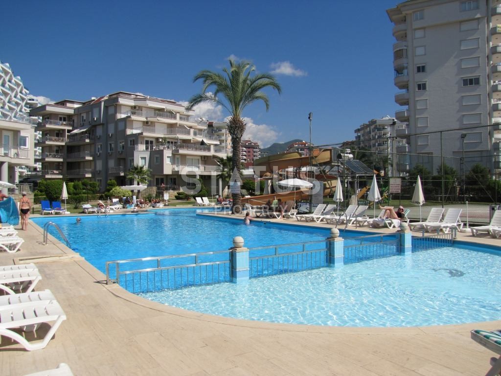 Апартаменты 1+1, 70 кв.м. в комплексе с большой территорией и низкоэтажной постройкой. Джикджилли, Алания. фото 4