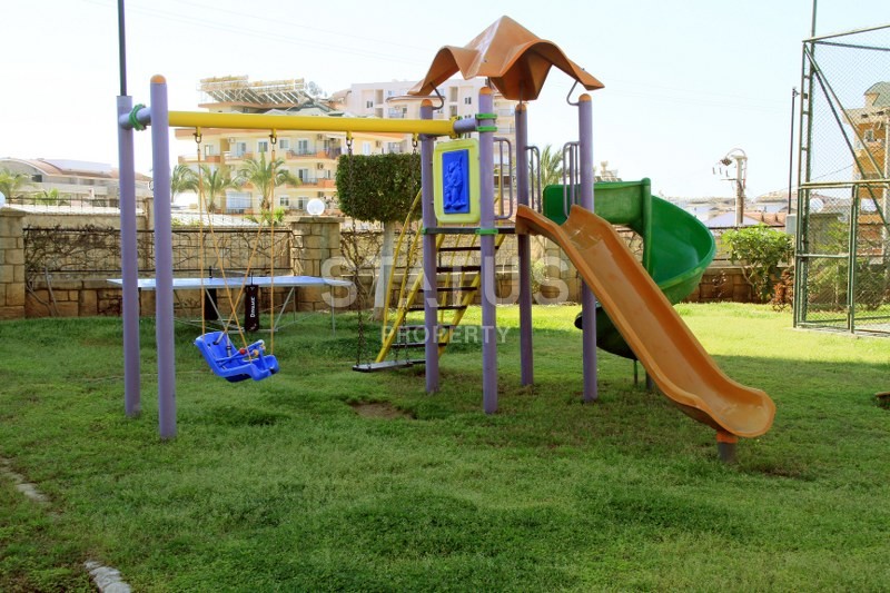 Апартаменты 1+1, 70 кв.м. в комплексе с большой территорией и низкоэтажной постройкой. Джикджилли, Алания. фото 6