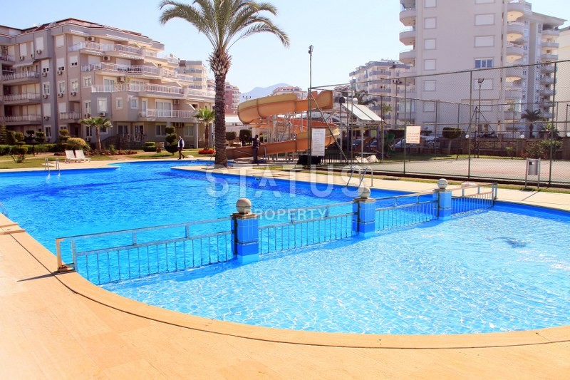 Апартаменты 1+1, 70 кв.м. в комплексе с большой территорией и низкоэтажной постройкой. Джикджилли, Алания. фото 7