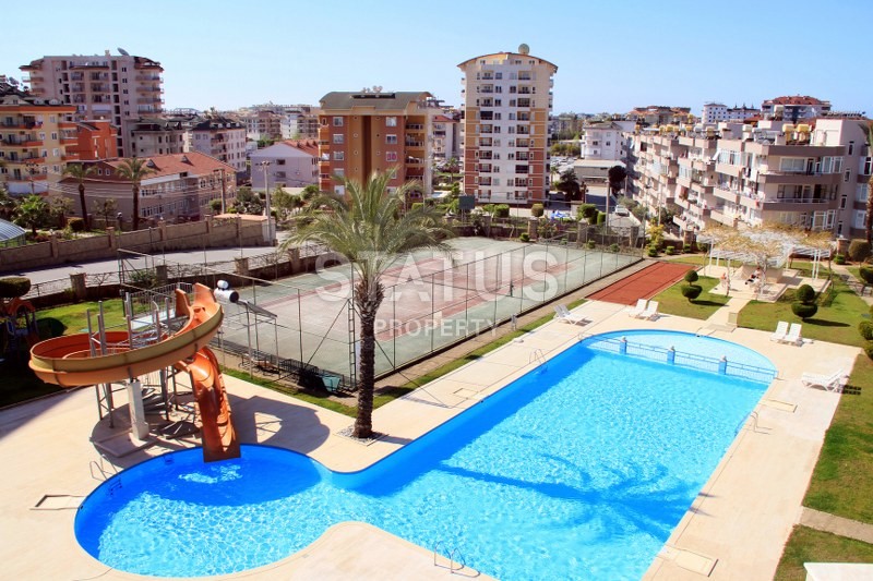 Апартаменты 1+1, 70 кв.м. в комплексе с большой территорией и низкоэтажной постройкой. Джикджилли, Алания. фото 8