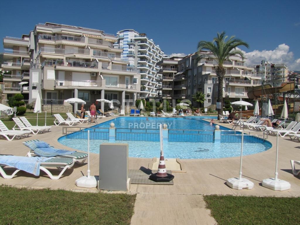 Апартаменты 1+1, 70 кв.м. в комплексе с большой территорией и низкоэтажной постройкой. Джикджилли, Алания. фото 10