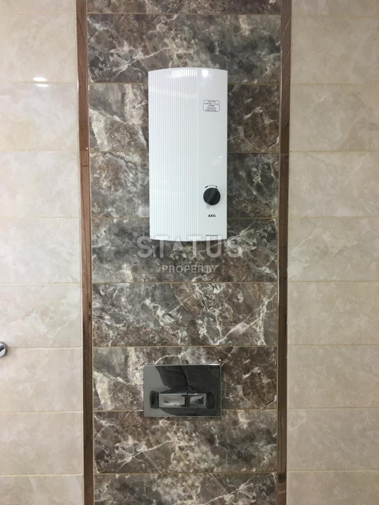 Furnished apartment 1+1 overlooking the sea and the historic city of Naula, 75 m2. Mahmutlar, Alanya. фото 25