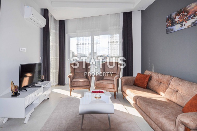 Двухкомнатная квартира 48 кв.м., укомплектованная мебелью в новом доме. Махмутлар, Алания. фото 1