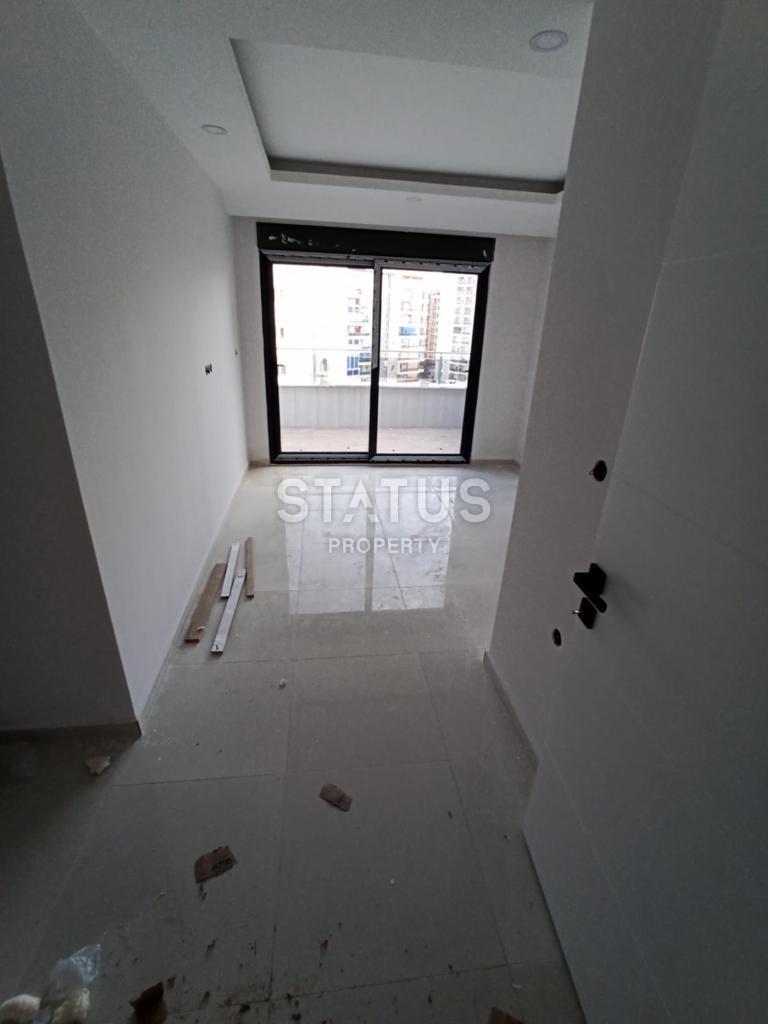 Двухуровневые апартаменты 2+1, 110 м2 в новом комплексе в Махмутларе. фото 18