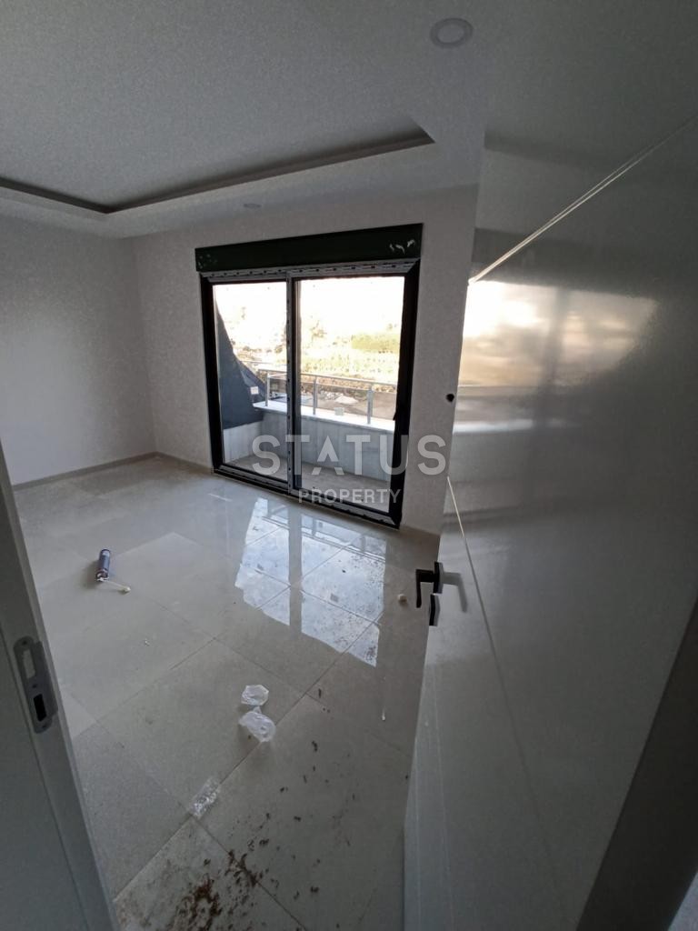 Двухуровневые апартаменты 2+1, 110 м2 в новом комплексе в Махмутларе. фото 20