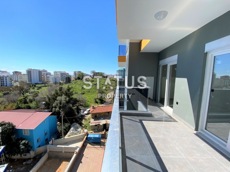 Апартаменты 2+1, 115 м2 в новом доме с видом на Наулу в Махмутларе. фото 1