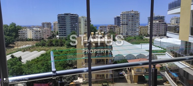 Квартира 55 кв.м. планировки 1+1 с видом на море в Махмутларе. фото 1