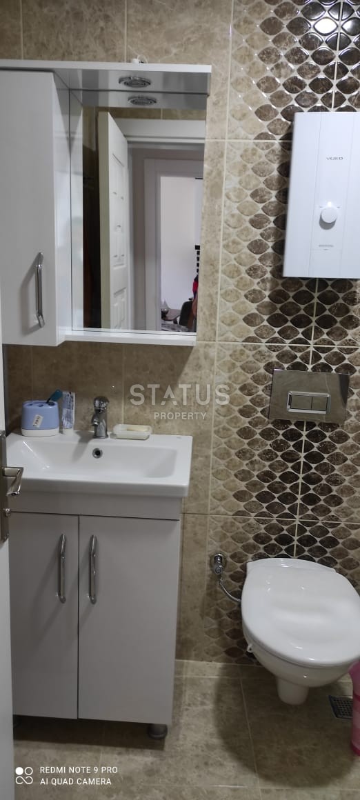 Квартира 55 кв.м. планировки 1+1 с видом на море в Махмутларе. фото 11