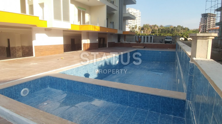 Просторная квартира 1+1 с большим балконом, возле Наулы в Махмутларе, 60 м2. фото 1