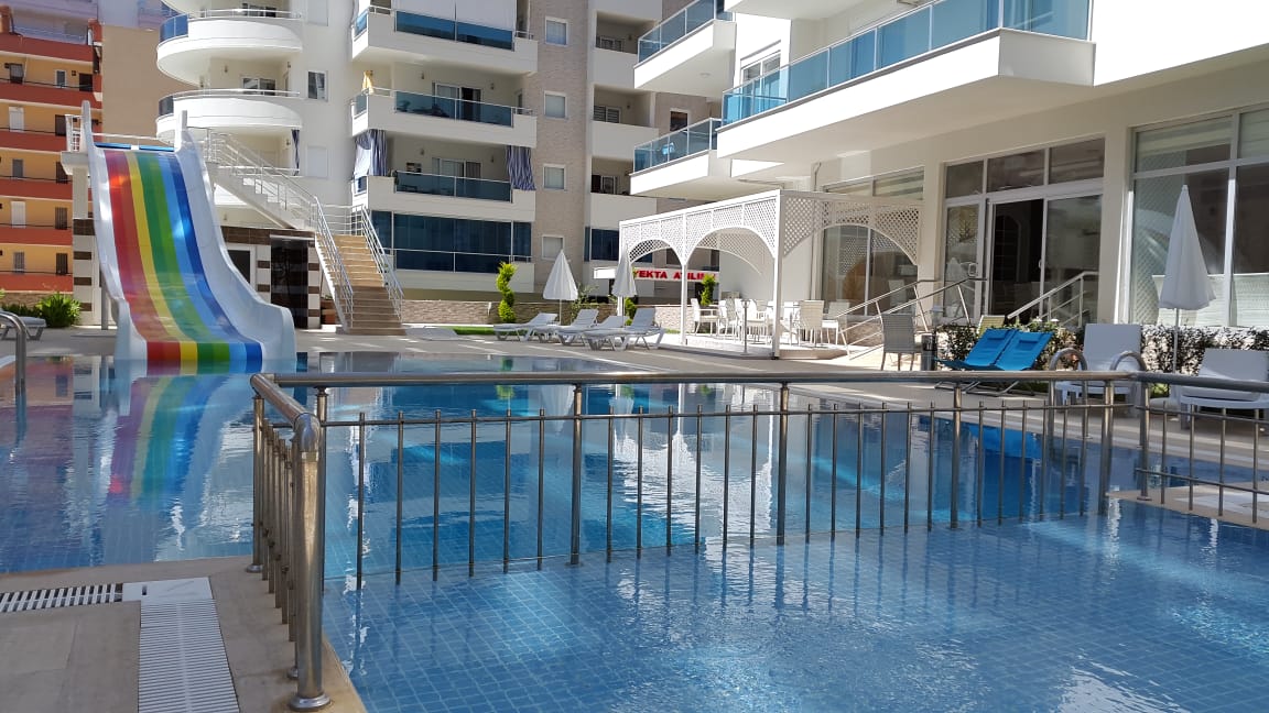 Большая двухкомнатная квартира 70м2, с частичным видом на море в центральной части Махмутлара. фото 4