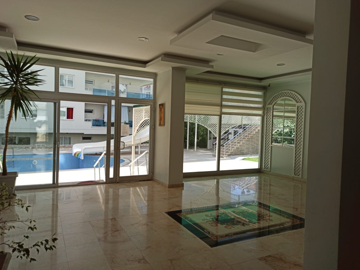 Большая двухкомнатная квартира 70м2, с частичным видом на море в центральной части Махмутлара. фото 11