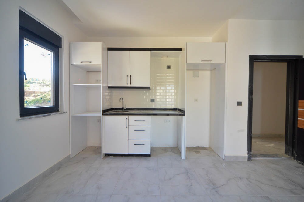 Две квартиры 1+1 в новом комплексе, 55 м2. Махмутлар, Алания. фото 54