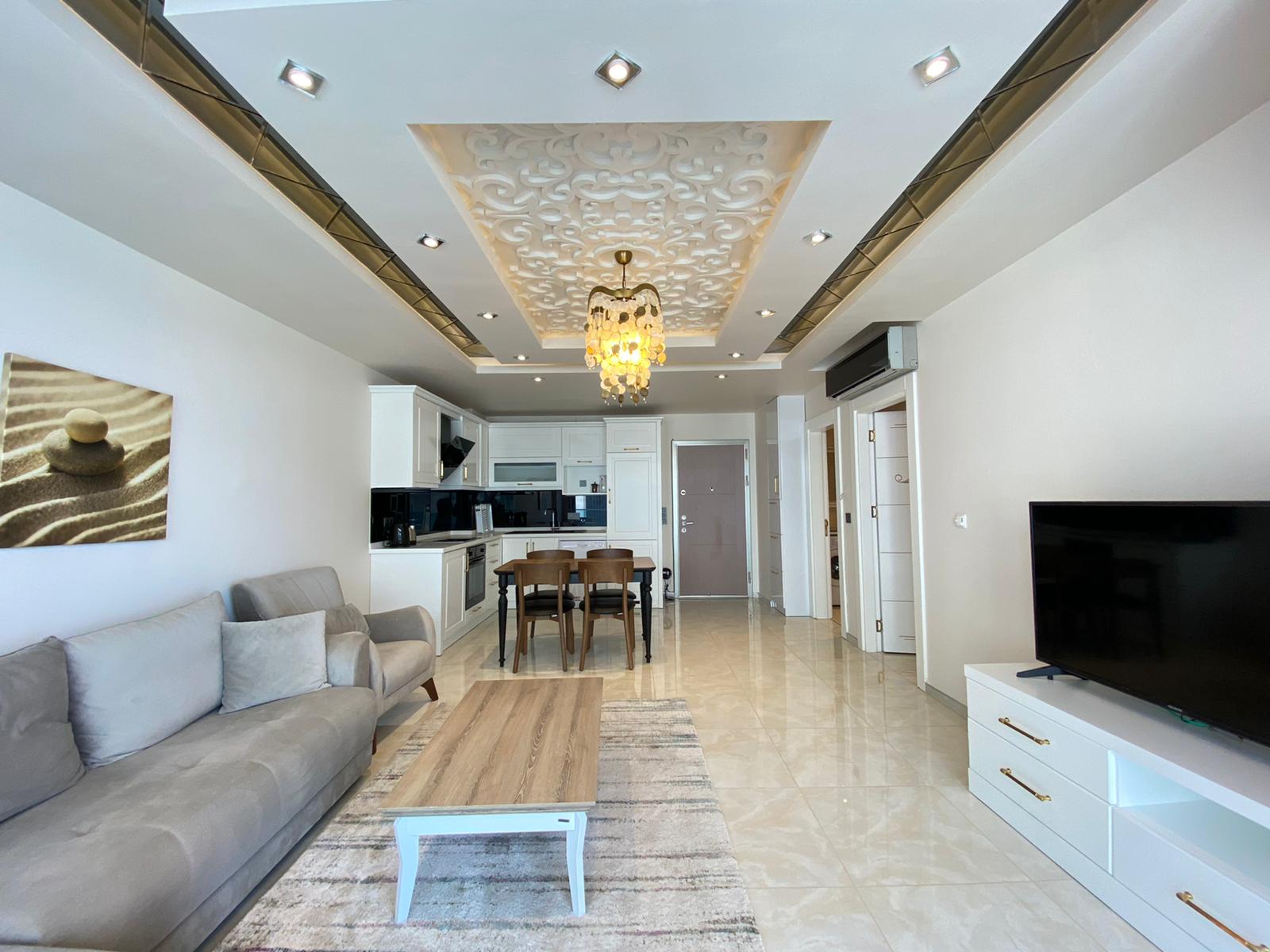 Квартира 1+1 с новой мебелью и боковыми видами на море и горы, в Махмутларе. 65кв.м. фото 7