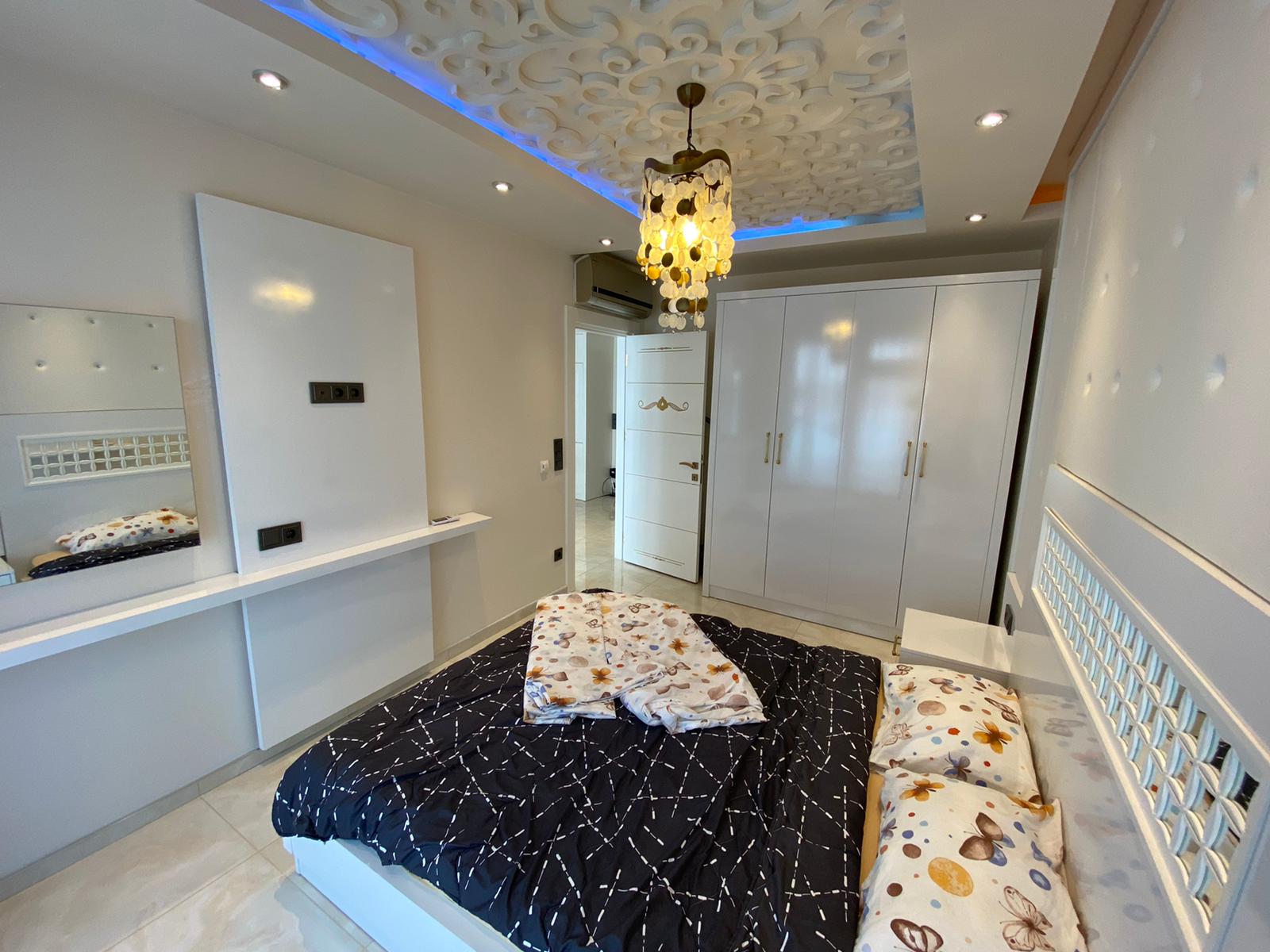 Квартира 1+1 с новой мебелью и боковыми видами на море и горы, в Махмутларе. 65кв.м. фото 9