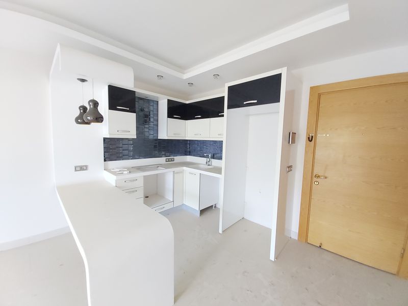 Просторная двухкомнатная квартира в элитном комплексе в Махмутларе, 70 м2 фото 24